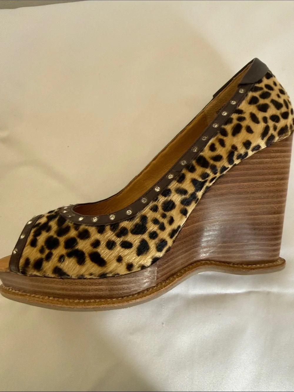 Animal print wedges with rhinestone trim. Leather upper size 8.